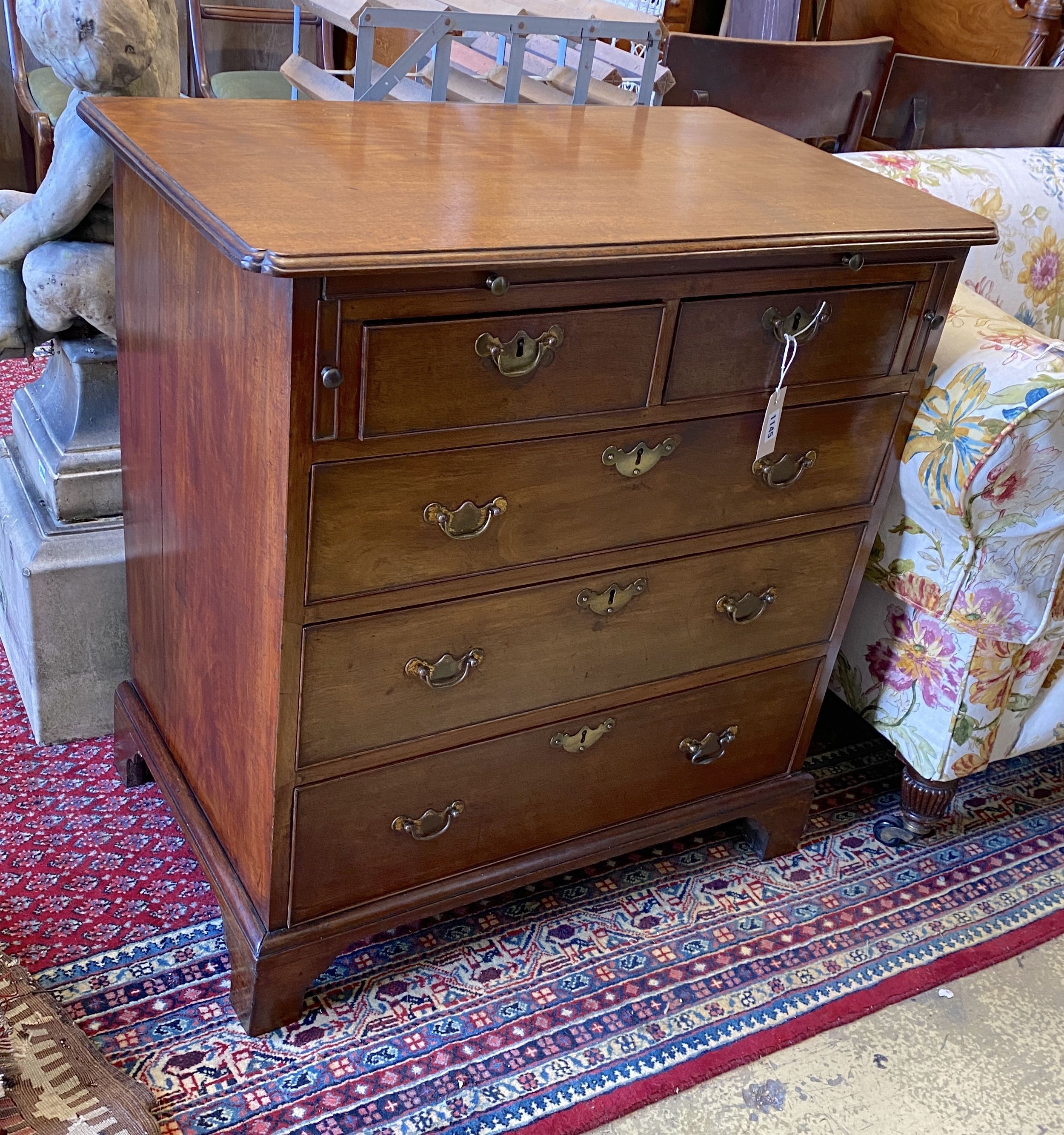 A George III mahogany bachelor's chest with brushing slide, width 82cm, depth 49cm, height 84cm